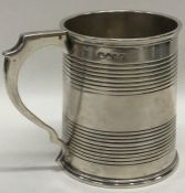 A Victorian tapering silver cream jug with reeded