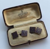 A pair of enamel decorated 18 carat cufflinks cont