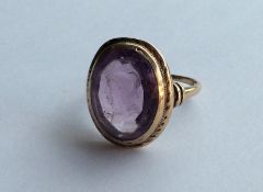 A 10 carat amethyst signet ring carved with a warr