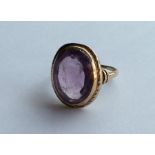 A 10 carat amethyst signet ring carved with a warr