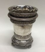 An Eastern silver three part beaker decorated with