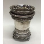 An Eastern silver three part beaker decorated with