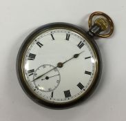 A gent's gun metal pocket watch with white enamell
