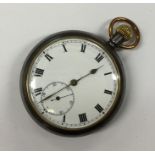 A gent's gun metal pocket watch with white enamell