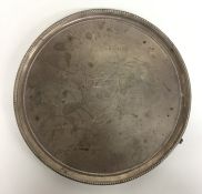 A large Georgian circular salver with crested armo