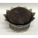 A large Continental silver pin cushion with flower