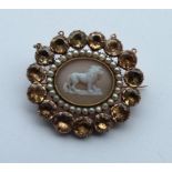 An attractive Antique oval brooch with central har