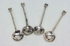 A set of four seal top silver salt spoons. London.