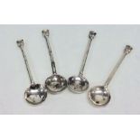 A set of four seal top silver salt spoons. London.