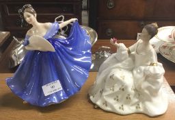 Two Royal Doulton figures of ladies.