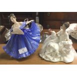 Two Royal Doulton figures of ladies.