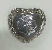 A small silver heart shaped pin dish. Birmingham.