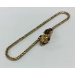 An Antique gold snake link bracelet decorated with
