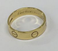 CARTIER: A gent's 18 carat gold wedding band of ty