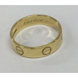 CARTIER: A gent's 18 carat gold wedding band of ty