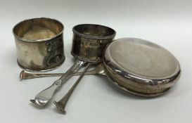 A collection of silver napkin rings, teaspoons etc