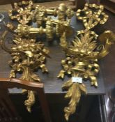 A pair of gilt wall sconces.