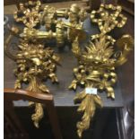 A pair of gilt wall sconces.