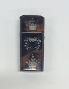 A tortoiseshell and silver inlaid etui decorated w