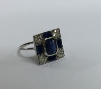 A sapphire and diamond square cocktail ring in pla