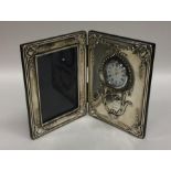 A large silver folding photograph frame / clock de