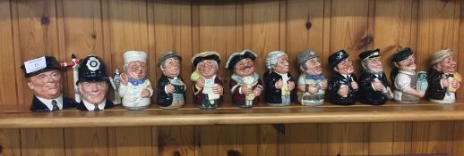 A group of miniature Toby jugs.