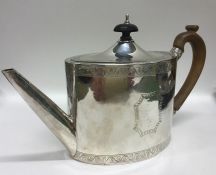 A good Georgian bright cut silver teapot with hing