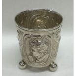 A heavy Continental silver beaker on three ball fe