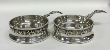 A good pair of silver cups decorated with flowers