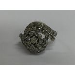 A large oval diamond dress ring in platinum mount.