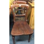 A pair of mahogany dining chairs.