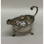 A Georgian miniature silver sauce boat with card c