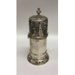 A large heavy silver lighthouse caster of typical