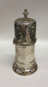 A large heavy silver lighthouse caster of typical