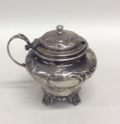 A Victorian embossed silver mustard decorated with