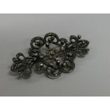 A large diamond brooch attractively decorated with