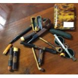 Old cigarette holders, glasses etc.