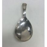 A Georgian silver caddy spoon with fluted bowl. Ap