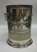 An unusual Edwardian silver bottle coaster with pi