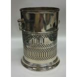 An unusual Edwardian silver bottle coaster with pi