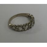A diamond half hoop ring in white gold 18 carat mo