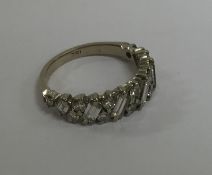 A diamond half hoop ring in white gold 18 carat mo