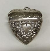 A modern silver heart shaped vesta decorated with