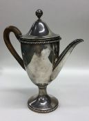 A Victorian silver water jug with rope twist decor