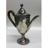 A Victorian silver water jug with rope twist decor