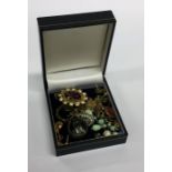 A box containing earrings, pendants etc. Est. £15