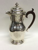 A good quality Edwardian silver water jug with hin