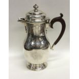 A good quality Edwardian silver water jug with hin