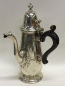 An Edwardian silver chocolate pot with scroll thum