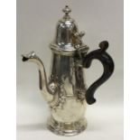 An Edwardian silver chocolate pot with scroll thum